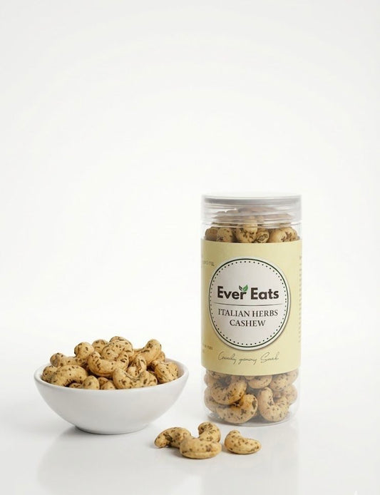 Jar of Ever Eats Italian Herbs Cashew with cashews in a bowl on a white background